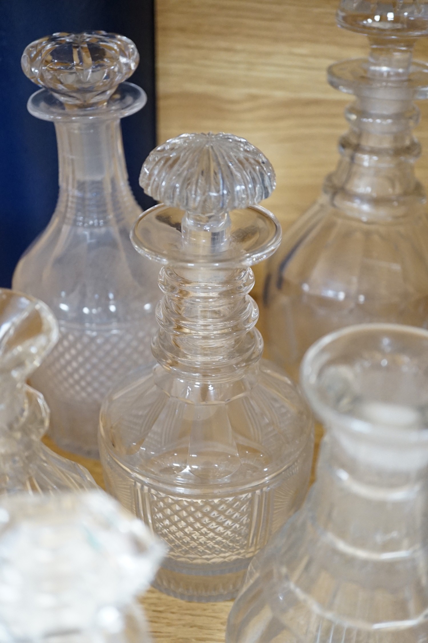 Twelve glass decanters and a carafe (13)